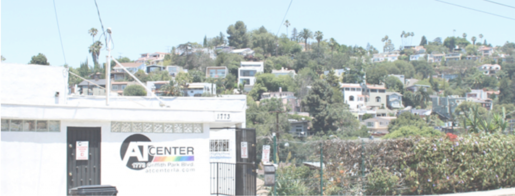 AT Center Los Angeles front entrance with logo on wall. Los Angeles hillside in background.